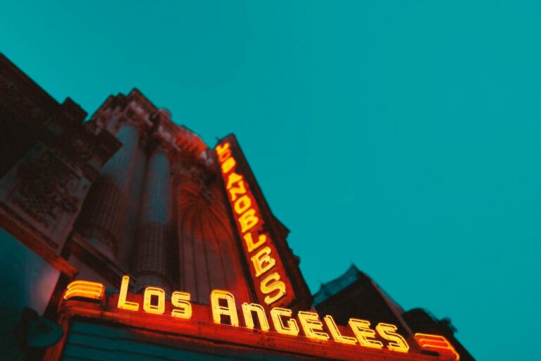 low angle photography of brown building with los angeles led sign