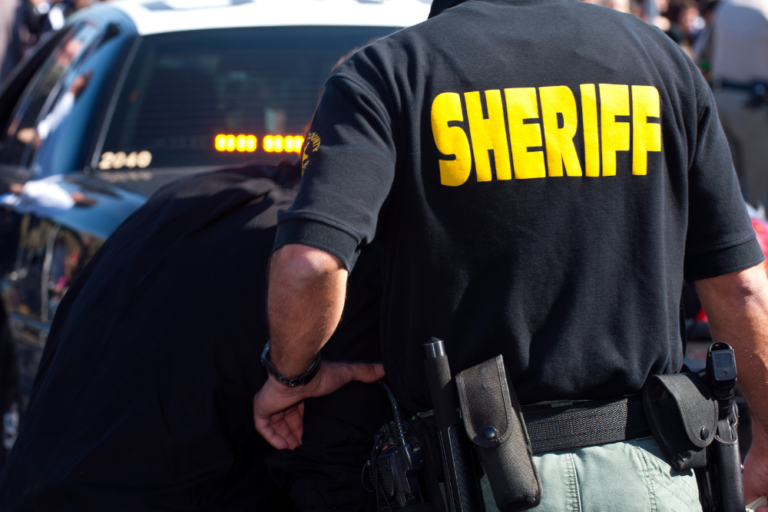 sheriff arresting person on bench warrant in California