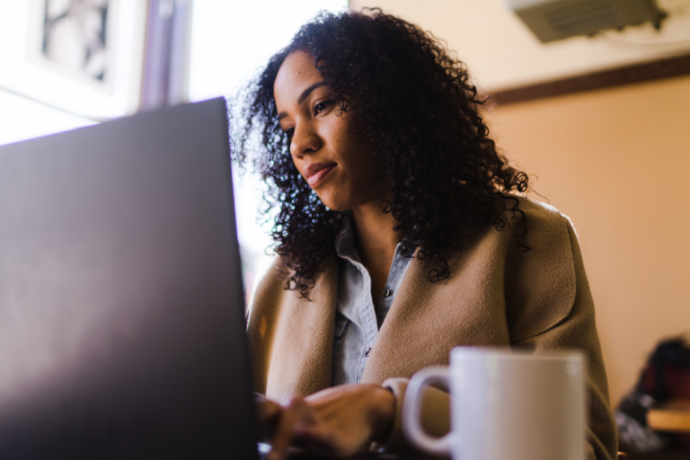 women cosigner bail bond researching options on laptop