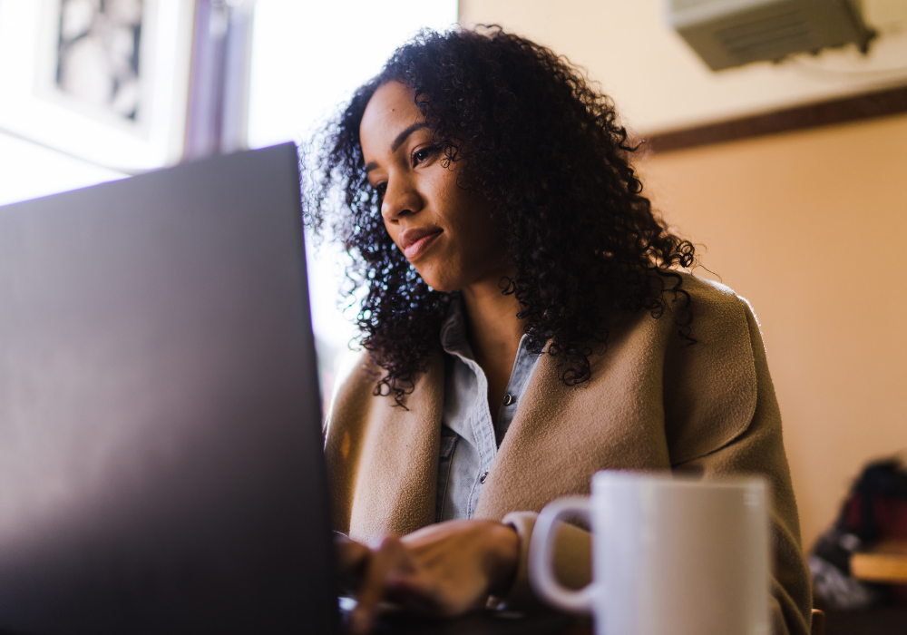 women cosigner bail bond researching options on laptop